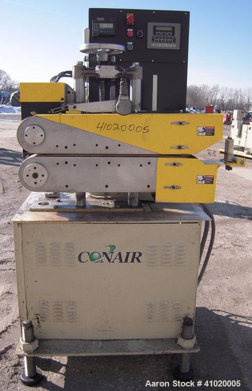 Used Conair Belt Puller, Model 4-26. (2) manually adjustable rubber belts, 3 3/4" wide x 30" long. Driven by a 2.46 hp, 3/60/240 volt, 3000 rpm motor. Mounts on casters.





