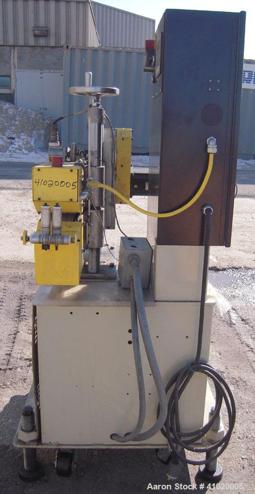 Used Conair Belt Puller, Model 4-26. (2) manually adjustable rubber belts, 3 3/4" wide x 30" long. Driven by a 2.46 hp, 3/60/240 volt, 3000 rpm motor. Mounts on casters.





