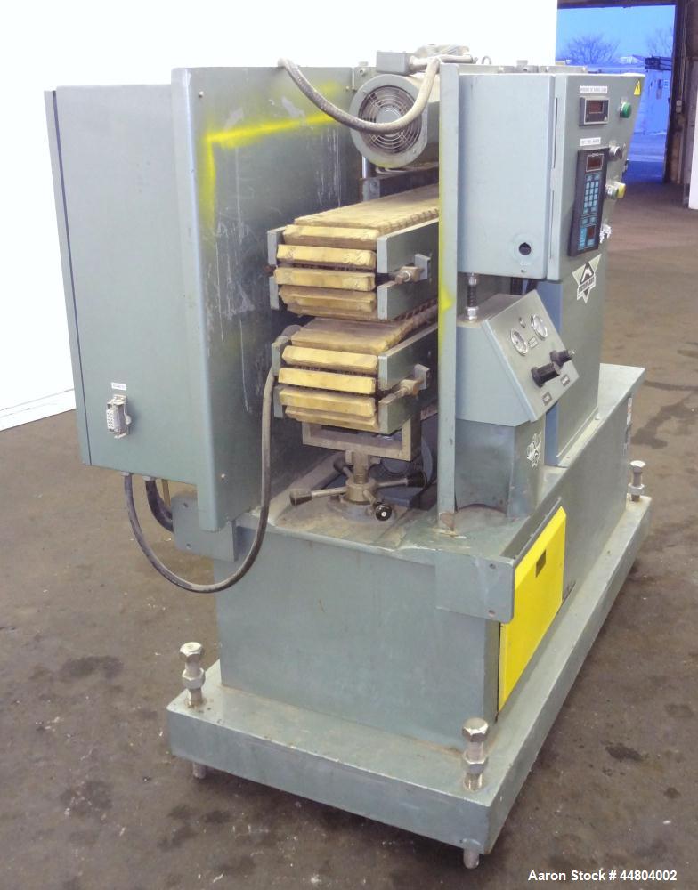 Used Conair Cleated Belt Puller, Model PC8-50-L.  7-1/2" Wide x 50" long contact surfaces.  Rated 1-10 feet per minute. Independently driven belts with 2 hp, 230/460 volt motors on stand with control...