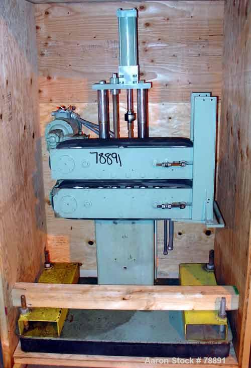 USED: Farris Foam Belt Puller. 4 1/2" wide x 22" long contact,pneumatically adjustable belts, approx 8" daylight. Each belt driven by a 3/4 HP, 3/60/230/460 Volts, 1800 RPM through a gear motor. Unit...