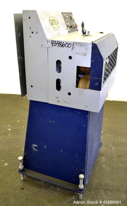 Used Gatto Cat-A-Puller, Model 202-3. (2) 3 Wide x 20 long contact manually adjustable rubber belts. Driven by a 2 hp, 180 volt, 1750 rpm  DC motor thru a reducer. Includes a Baldor DC drive. Mounted...