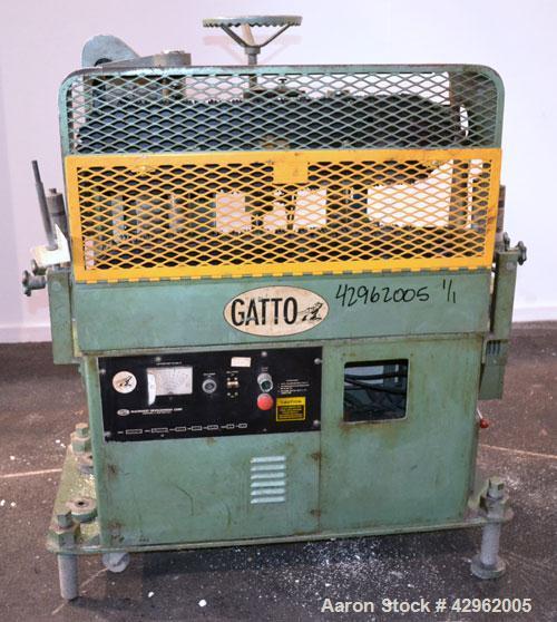 Used Gatto Cat-A-Puller, Model 207-3PC. (2) 3 Wide x 28 long contact cleated rubber belts. Manually adjustable 5 belt opening. Belt speed 1/2-60 feet per minute. Driven by a 3hp, 180 volt DC motor th...