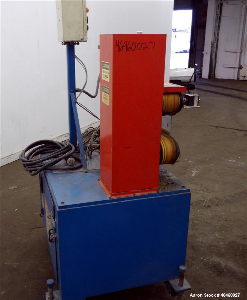 Used Goodman Stand-Alone Puller, Model 4F. (2) 4" Wide x 30" long belts. Driven by a approximate 2hp motor, with gear box, 15 to 1 ratio. Maximum daylight 4". Approximate operating speeds up to 500 f...