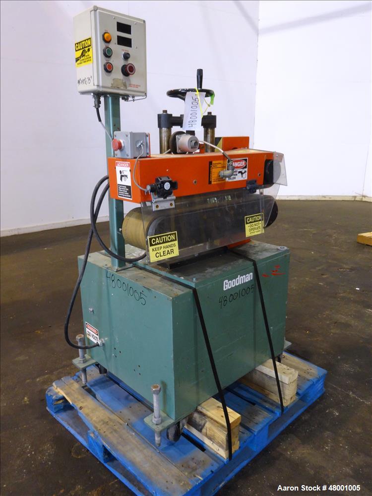 Used Goodman Stand-Alone Puller, Model 6E. Approximately 6" Wide x 24" Long. Manual adjustable raise. Maximum belt opening 6". Driven by a 1hp, 1/60/180 volt, 1750 rpm motor. Mounted on a carbon stee...