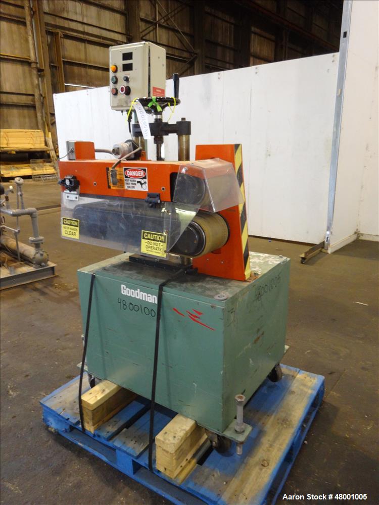 Used Goodman Stand-Alone Puller, Model 6E. Approximately 6" Wide x 24" Long. Manual adjustable raise. Maximum belt opening 6". Driven by a 1hp, 1/60/180 volt, 1750 rpm motor. Mounted on a carbon stee...