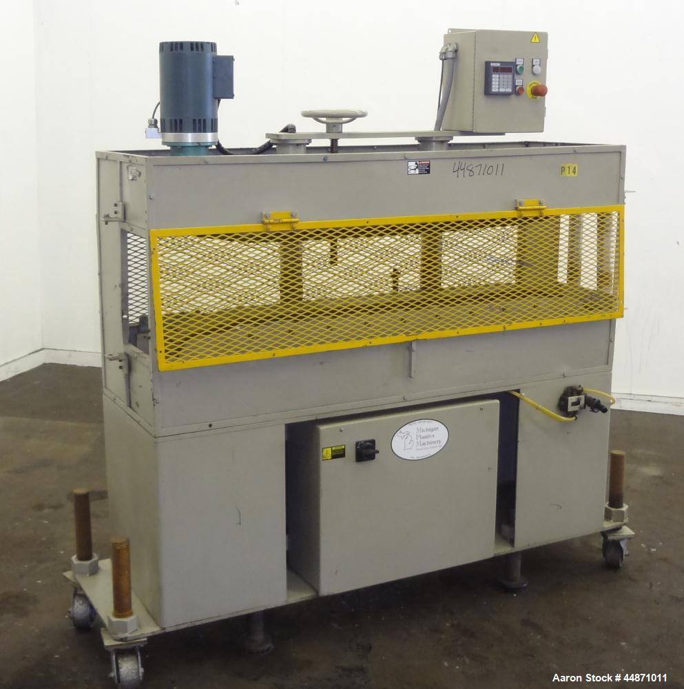 Used Michigan Plastics Machinery Puller.  (2) 5-1/2" Wide x 49" long contact cleated rubber belts.  Manually adjustable approximately 10" belt opening.  Each belt driven by a 1.5 hp, 3/60/208-230/460...