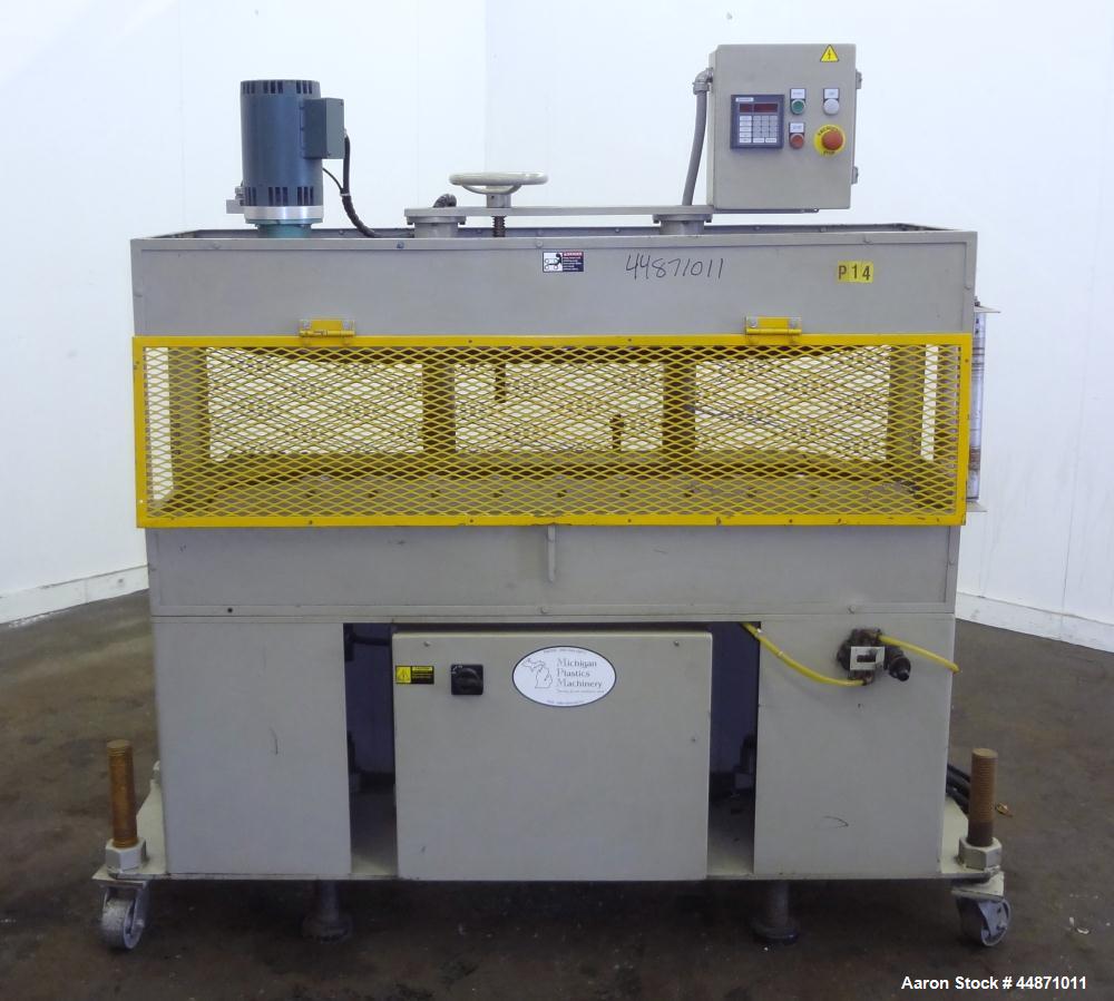 Used Michigan Plastics Machinery Puller.  (2) 5-1/2" Wide x 49" long contact cleated rubber belts.  Manually adjustable approximately 10" belt opening.  Each belt driven by a 1.5 hp, 3/60/208-230/460...