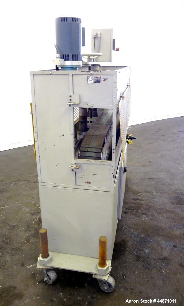 Used Michigan Plastics Machinery Puller.  (2) 5-1/2" Wide x 49" long contact cleated rubber belts.  Manually adjustable approximately 10" belt opening.  Each belt driven by a 1.5 hp, 3/60/208-230/460...