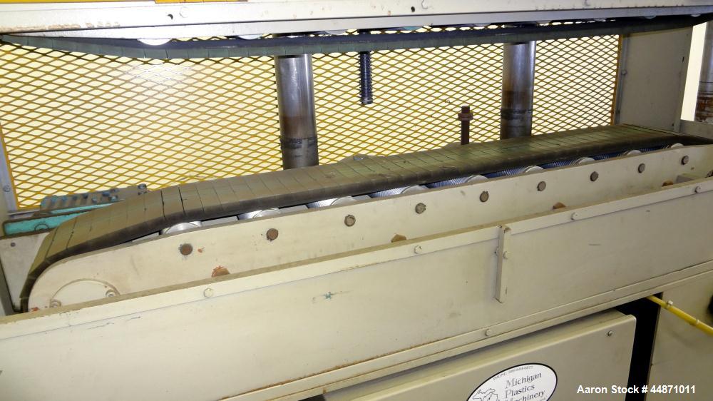 Used Michigan Plastics Machinery Puller.  (2) 5-1/2" Wide x 49" long contact cleated rubber belts.  Manually adjustable approximately 10" belt opening.  Each belt driven by a 1.5 hp, 3/60/208-230/460...