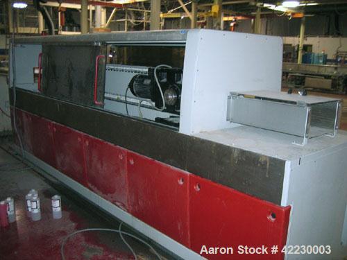 Used Greiner Cleated Belt Puller, Model 30/9-300. (2) 12" wide x 108" long cleated belts. Each belt driven by a 3 kw gear motor. Includes a control panel. Built 2006.