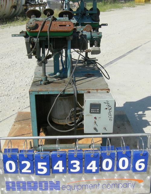 Used Puller, "V" Shaped.  (2)  1 3/4" wide x 12" long belts.  Manually adjustable height. Driven by a  3/4 hp, 90 volt, 2500 rpm DC gearmotor.