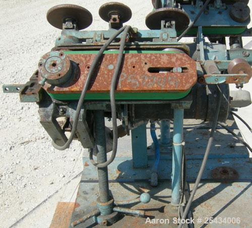 Used-  Puller, "V" Shaped.  (2)  1 3/4" wide x 12" long belts.  Manually adjustable height. Driven by a  3/4 hp, 90 volt, 25...