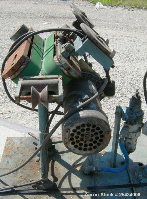 Used Puller, "V" Shaped.  (2)  1 3/4" wide x 12" long belts.  Manually adjustable height. Driven by a  3/4 hp, 90 volt, 2500 rpm DC gearmotor.