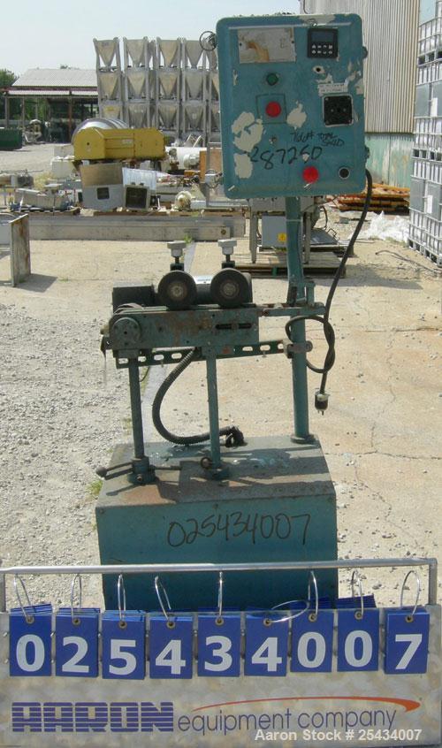 Used Puller, 2" wide x 12" long bottom belt.  (2) 4" diameter x 2" wide top rubber rolls.  Manually adjustable.  Driven by a 1/2 hp, 90 volt, 2500 rpm DC gearmotor.