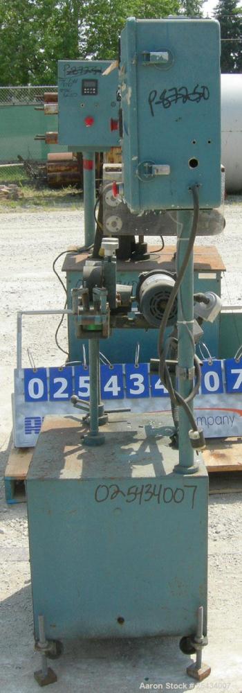 Used Puller, 2" wide x 12" long bottom belt.  (2) 4" diameter x 2" wide top rubber rolls.  Manually adjustable.  Driven by a 1/2 hp, 90 volt, 2500 rpm DC gearmotor.