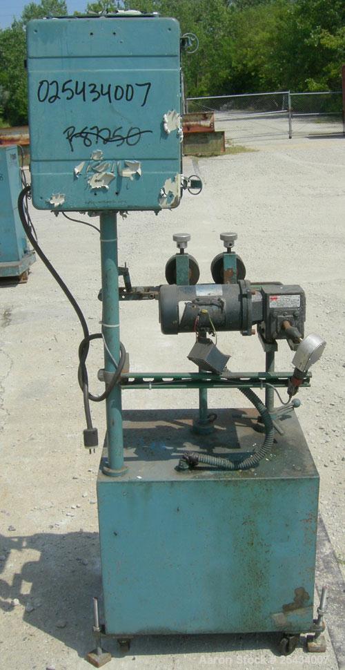Used-  Puller, 2" wide x 12" long bottom belt.  (2) 4" diameter x 2" wide top rubber rolls.  Manually adjustable.  Driven by...