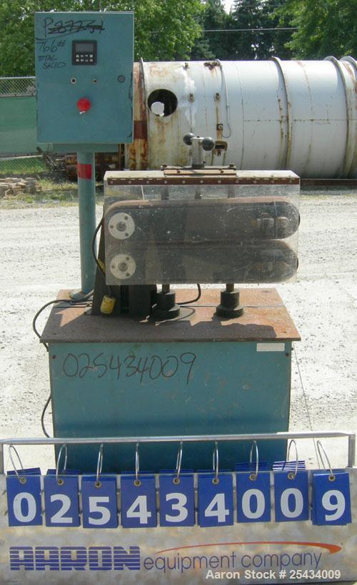Used Puller, (2) 3" wide x 22" long belts.  Manually adjustable height.  Driven by a 1/2 hp, 90 volt, 1750 rpm DC gearmotor.