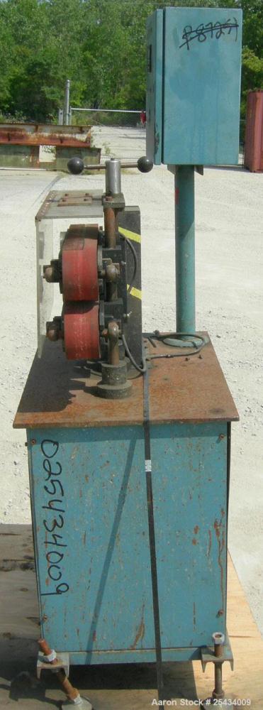 Used Puller, (2) 3" wide x 22" long belts.  Manually adjustable height.  Driven by a 1/2 hp, 90 volt, 1750 rpm DC gearmotor.