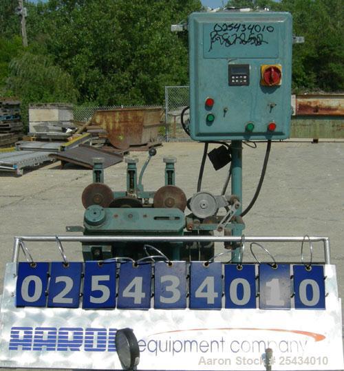 Used Puller, "V" Shaped.  (2)  2" wide x 12" long belts.  Manually adjustable height.  Driven by a 1/2 hp, 90 volt, 1725 rpm DC gearmotor.