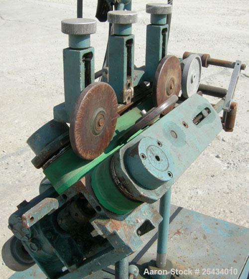 Used-  Puller, "V" Shaped.  (2)  2" wide x 12" long belts.  Manually adjustable height.  Driven by a 1/2 hp, 90 volt, 1725 r...
