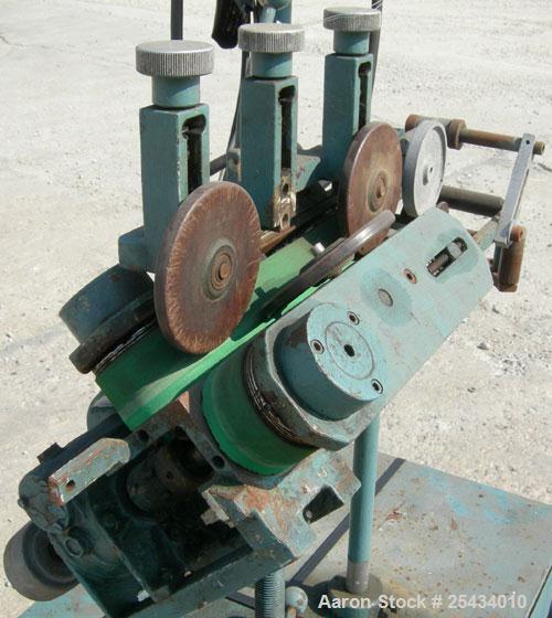 Used Puller, "V" Shaped.  (2)  2" wide x 12" long belts.  Manually adjustable height.  Driven by a 1/2 hp, 90 volt, 1725 rpm DC gearmotor.