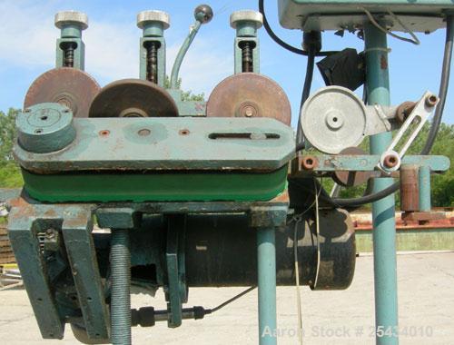 Used Puller, "V" Shaped.  (2)  2" wide x 12" long belts.  Manually adjustable height.  Driven by a 1/2 hp, 90 volt, 1725 rpm DC gearmotor.