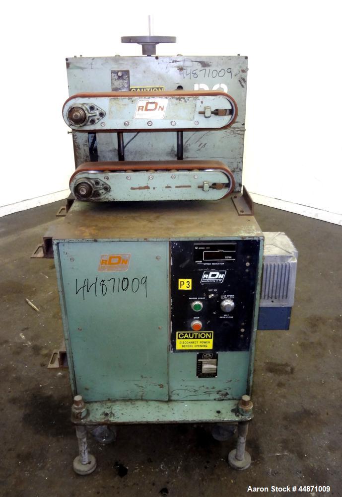 Used RDN Belt Puller, Model 118-5.  (2) Approximately 3.75" wide x 18" long contact area belts, manually adjustable, approximately 5" maximum daylight. Capacity up to 4" diameter product. Driven by a...