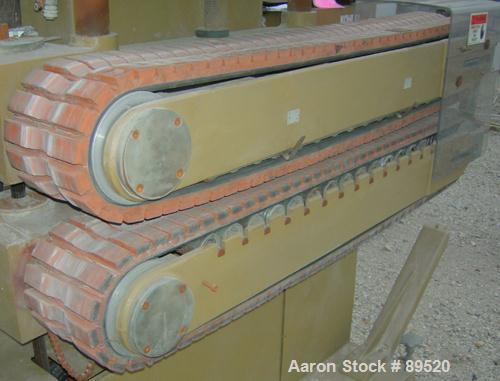 USED: Royal Machine cleated belt puller/cutter, model 055. (2) 7-1/2" wide x 58" long contact area belts, driven by an approximate 2 hp motor; (1) chop saw, approximate 14" diameter blade, driven by ...