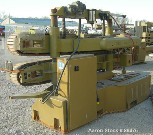 USED: Becz Machine belt puller, model 056. (2) 8" wide x 8' long contact area. Top belt motorized adjustment, bottom belt manually adjustable. Driven by an approximate 5 hp motor. Includes control pa...