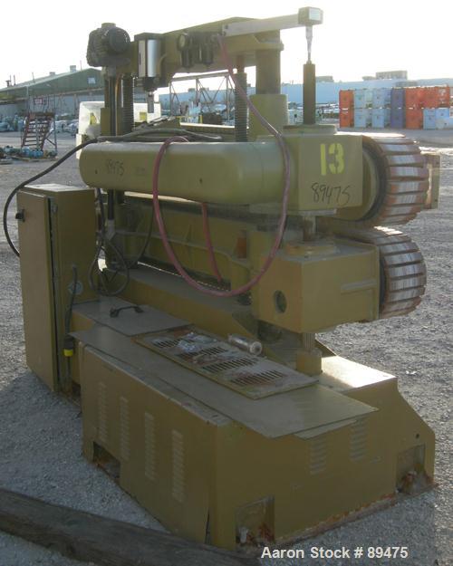 USED: Becz Machine belt puller, model 056. (2) 8" wide x 8' long contact area. Top belt motorized adjustment, bottom belt manually adjustable. Driven by an approximate 5 hp motor. Includes control pa...