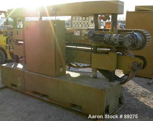 Used Royal Machine Cleated Belt Puller, Model 067. (2) 10" wide x 12' long contact area. Pneumatically adjustable belts. Each belt driven by a 2 hp, 640 volt, 2500 rpm DC gearmotor. (1 belt missing m...