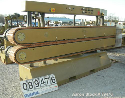 USED: Royal Machine cleated belt puller, model 067. (2) 10" wide x 12' long contact area. Pneumatically adjustable belts. Each belt driven by a 2 hp, 230/460 volt, 1750 rpm  gearmotor. Includes contr...