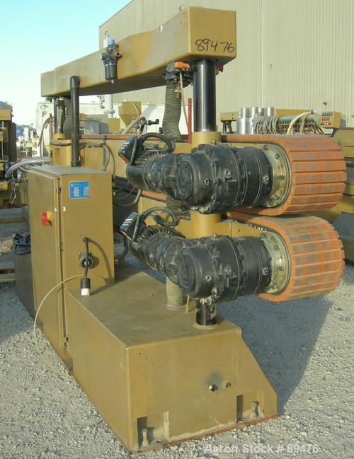 USED: Royal Machine cleated belt puller, model 067. (2) 10" wide x 12' long contact area. Pneumatically adjustable belts. Each belt driven by a 2 hp, 230/460 volt, 1750 rpm  gearmotor. Includes contr...