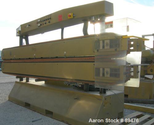 USED: Royal Machine cleated belt puller, model 067. (2) 10" wide x 12' long contact area. Pneumatically adjustable belts. Each belt driven by a 2 hp, 230/460 volt, 1750 rpm  gearmotor. Includes contr...