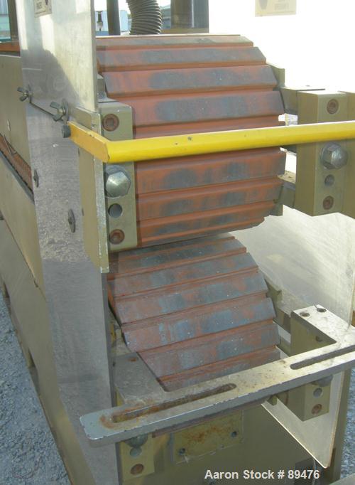 USED: Royal Machine cleated belt puller, model 067. (2) 10" wide x 12' long contact area. Pneumatically adjustable belts. Each belt driven by a 2 hp, 230/460 volt, 1750 rpm  gearmotor. Includes contr...