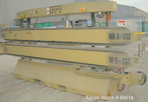 USED: Royal Machine cleated belt puller, model 067. (2) 10" wide x 12' long contact areas. Pneumatically adjustable belts. Each belt driven by a 2 hp, 640 volt, 2500 rpm DC gearmotor. Includes contro...