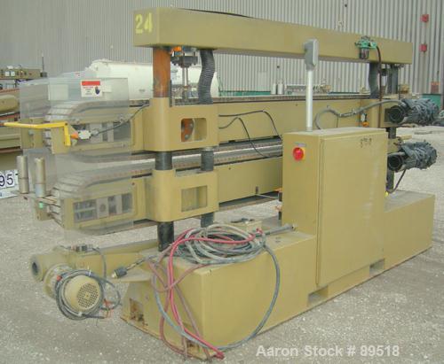 USED: Royal Machine cleated belt puller, model 067. (2) 10" wide x 12' long contact areas. Pneumatically adjustable belts. Each belt driven by a 2 hp, 640 volt, 2500 rpm DC gearmotor. Includes contro...