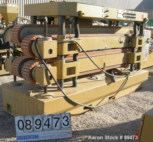 USED: Royal Machine dual lane cleated belt puller, model 069. (2) Lanes each with (2) 8" wide x 12' long contact area. Pneumatically adjustable belts. Driven by an approximate 15 hp motor. Includes c...