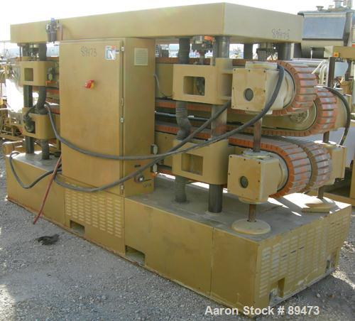 USED: Royal Machine dual lane cleated belt puller, model 069. (2) Lanes each with (2) 8" wide x 12' long contact area. Pneumatically adjustable belts. Driven by an approximate 15 hp motor. Includes c...