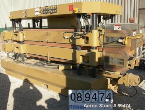 USED: Royal Machine dual lane cleated belt puller, model 069. (2) Lanes each with (2) 8" wide x 12' long contact area. Pneumatically adjustable belts. Driven by an approximate 15 hp motor. Includes c...