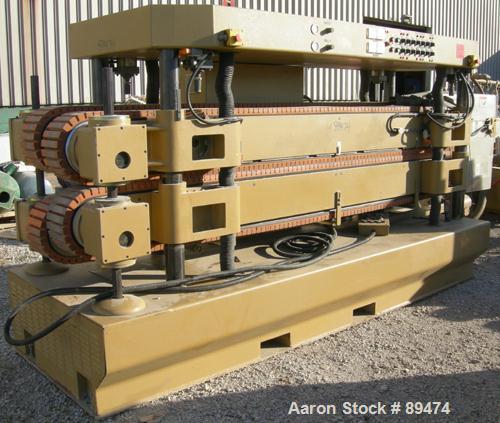 USED: Royal Machine dual lane cleated belt puller, model 069. (2) Lanes each with (2) 8" wide x 12' long contact area. Pneumatically adjustable belts. Driven by an approximate 15 hp motor. Includes c...