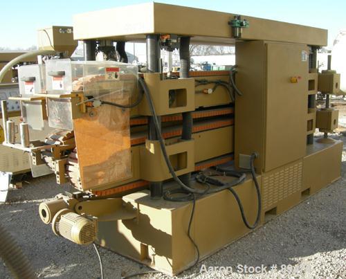 USED: Royal Machine dual lane cleated belt puller, model 069. (2) Lanes each with (2) 8" wide x 12' long contact area. Pneumatically adjustable belts. Driven by an approximate 15 hp motor. Includes c...
