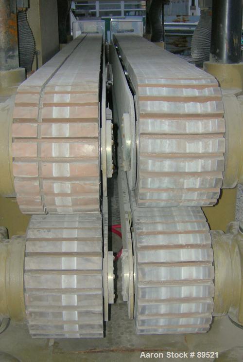 USED: Royal Machine dual lane cleated belt puller, model 069. (2) Lanes each with (2) 8" wide x 12' long contact area. Pneumatically adjustable belts. Driven by an approximate 15 hp motor. Includes c...