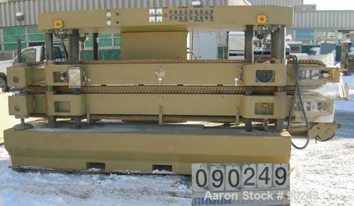 USED: Royal Machine dual lane cleated belt puller, model 069. (2) Lanes each with (2) 8" wide x 12' long contact area. Pneumatically adjustable belts. Driven by an approximate 15 hp motor. Includes c...
