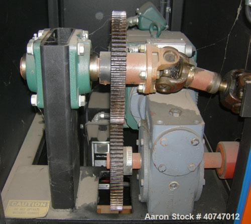 Used Vulcan Belt Puller. 4" wide x 27" long contact length rubber belts, manually adjustable. Driven by a 3 hp, 180 volt, 1750 rpm DC gearmotor, ratio 20 to 1. Includes a Reliance drive panel. Mounte...
