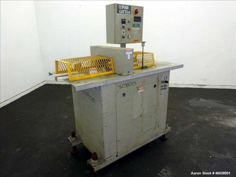 Used Conair Jetro Gatto Cut-Off Saw, Model UC-4-18. Approximate 16" diameter cutting blade. 18" Travel, 4-1/2" O.D. capacity with a 25" maximum cut length. Driven by a 1hp, 3/60/208-230/460 volt, 345...