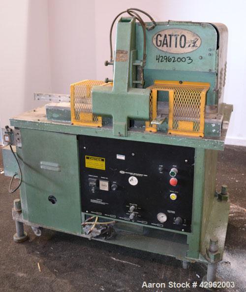 Used Gatto Traveling Center Arm Saw, Model OPS-7-24. 20 Diameter blade, 24 table travel, 7 O.D. capacity, maximum 12 cuts per minute. Driven by a 3hp, 3/60/208-230/460 volt, 1725 rpm motor. Mounted o...