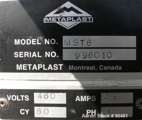 USED: Metaplas traveling cut off saw, model MST-6. Upacting saw blade. Approximate 32" x 52" traveling table. Top air operated hold down. Driven by an approximate 3 hp motor. Includes a dust collecto...