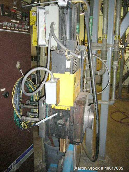 Used Dynisco 4.5" Hydraulic Screen Changer. Includes a stand and hydraulic pump.