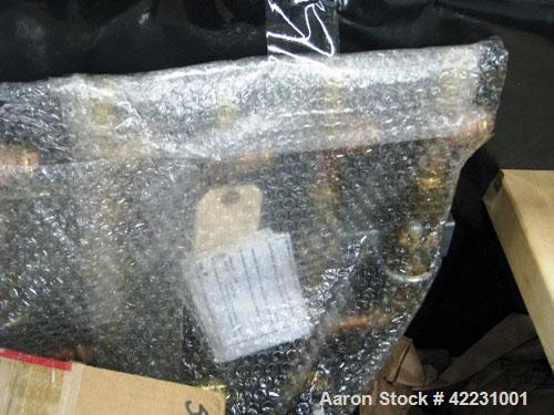 Used Hi-Tech Continuous Screen Changer, model E07R-XL, fully automatic. Includes time cycle based screen feed controls, upstream adapter, 120' roll of 72/15-P mesh screen. Manufactured 2006.